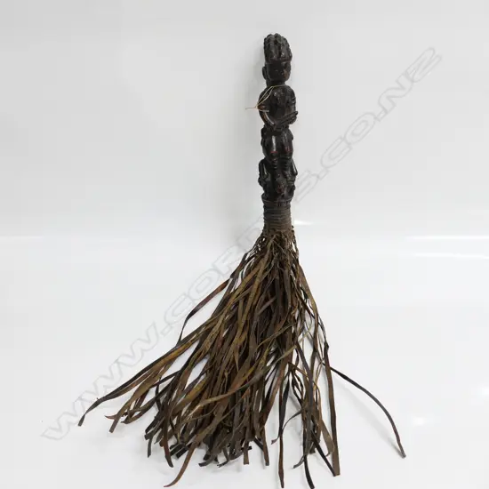 AFRICAN YORUBA CARVED FIGURE HANDLED LEATHER FLY WHISK. The figure with firearm, L.640mm