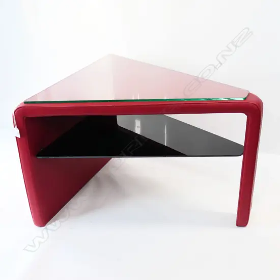 de Sede OF SWITZERLAND RED LEATHER TRIANGULAR SIDE TABLE. 660 x 740 x 505mm.