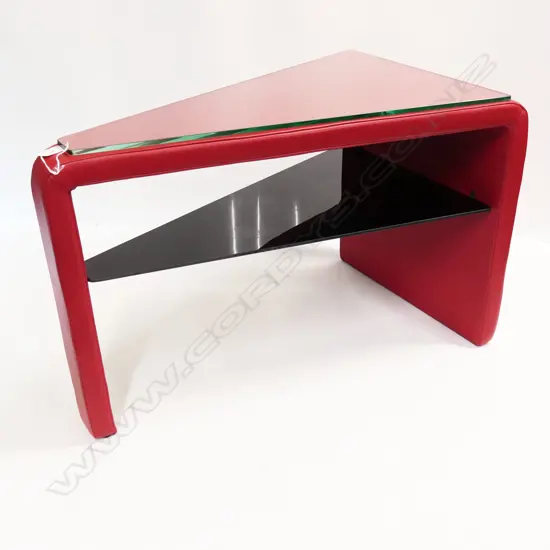 de Sede OF SWITZERLAND RED LEATHER TRIANGULAR SIDE TABLE. 470 x 780 x 505mm.