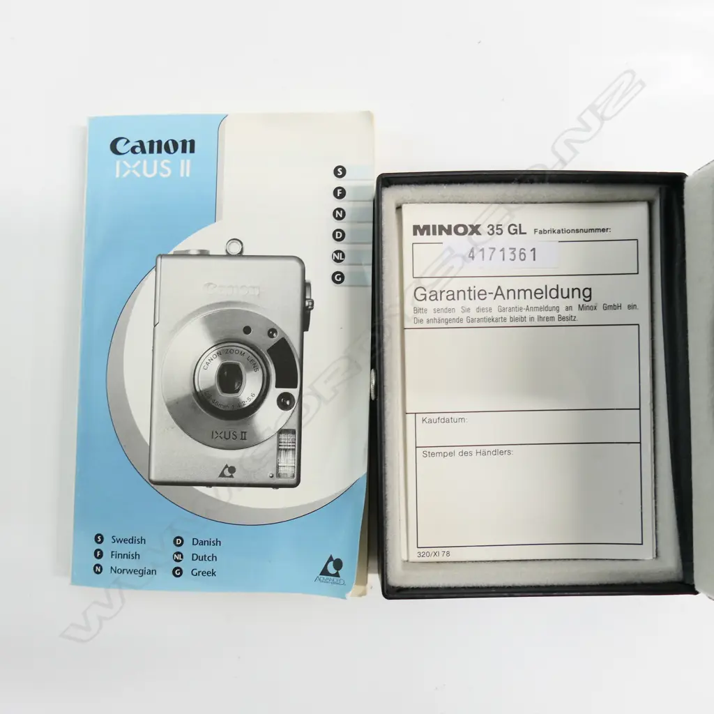 3 CAMERAS: CANON IXUS + MINOX 35GL,CANON IXUS II + CASE & MANUAL (on short tripods) Image 1++