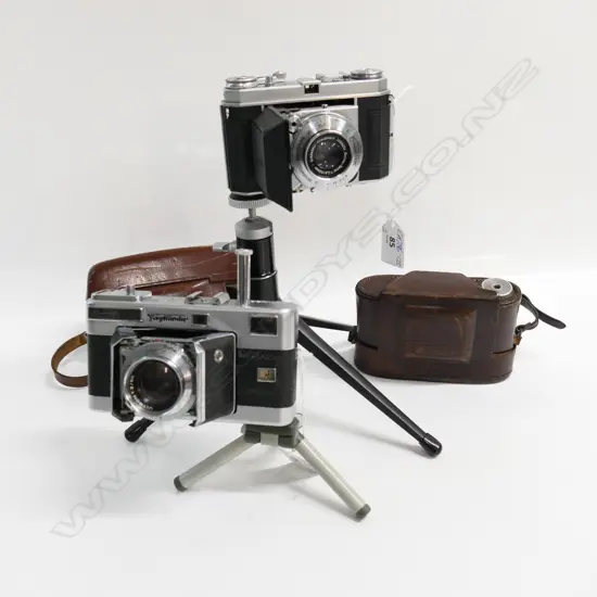 2 VINTAGE 35mm FILM CAMERAS with leather cases on short tripods: Voigtländer Vitessa + Kodak Retina Ia