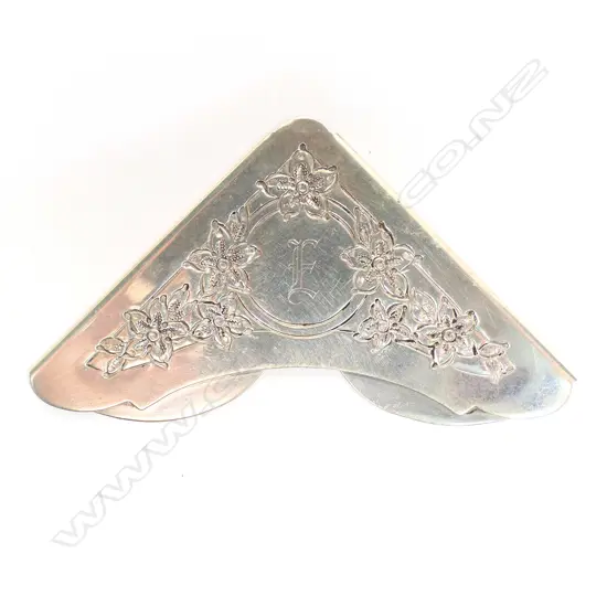 A silver Gorham corner bookmark,