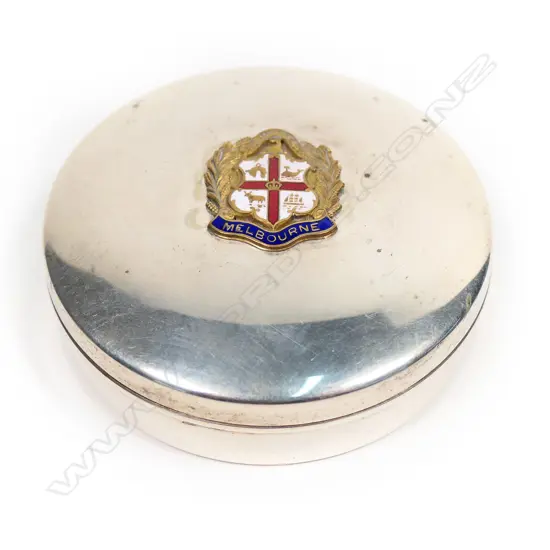 A vintage EPNS circular tin with Melbourne badge,