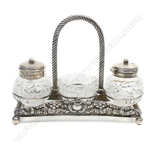 An Edwardian silver and glass condiment set,