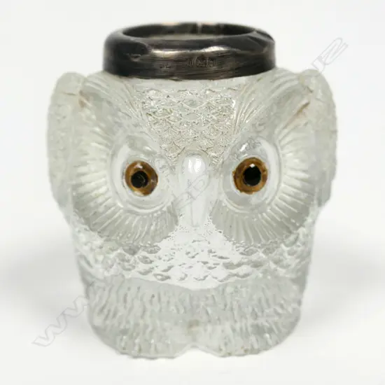An Edwardian moulded glass and silver owl match striker,