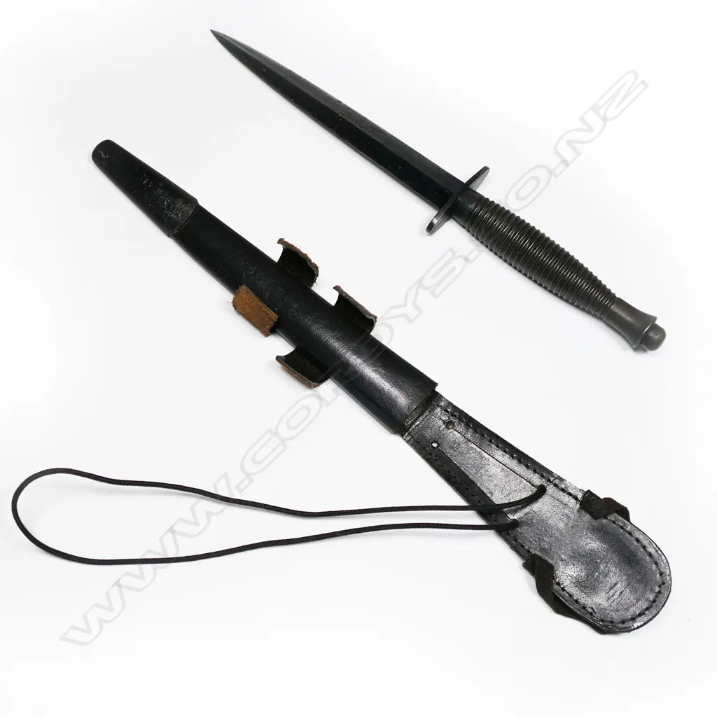 Fairbairn Sykes dagger with leather scabbard. Possibly not original scabbard and blade appears shortened. L.285mm Image 1++