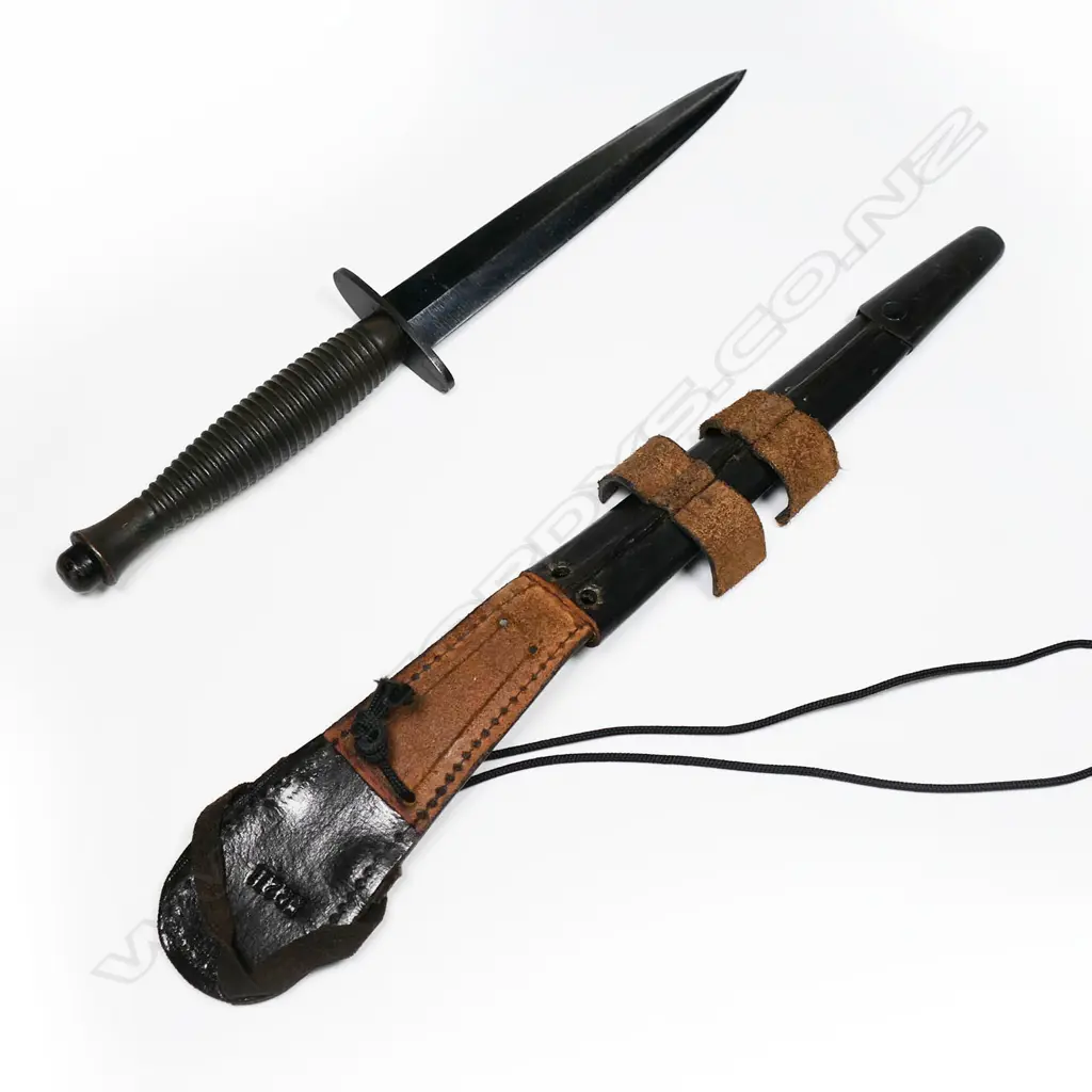 Fairbairn Sykes dagger with leather scabbard. Possibly not original scabbard and blade appears shortened. L.285mm Image 1++
