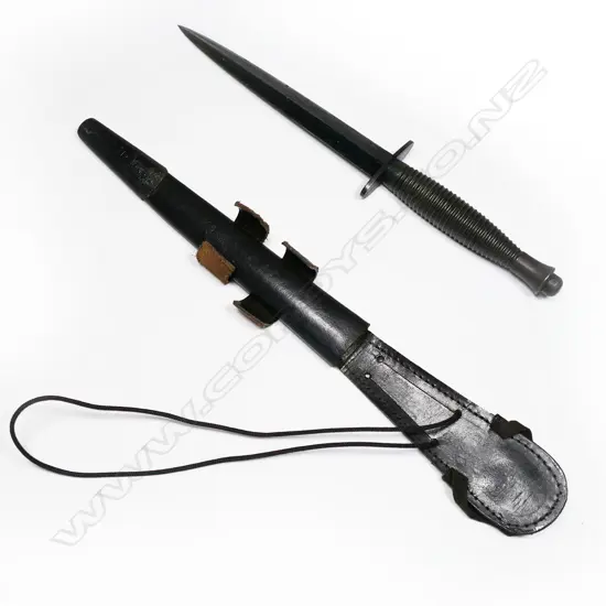Fairbairn Sykes dagger with leather scabbard. Possibly not original scabbard and blade appears shortened. L.285mm