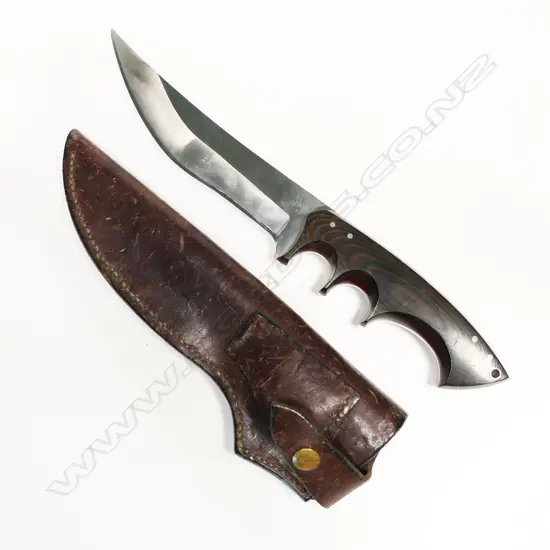 Large custom-made knife dated 1992 and in leather scabbard. L.340mm