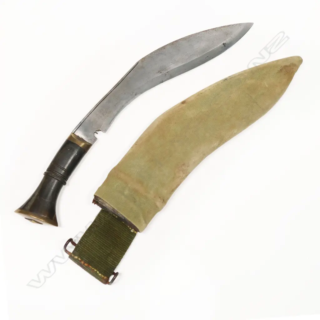 Gurkha Kukri in military scabbard. The Kukri Nepalese made. The scabbard has a WWI/II appearance. The kukri may be more recent. L.400mm Image 1++