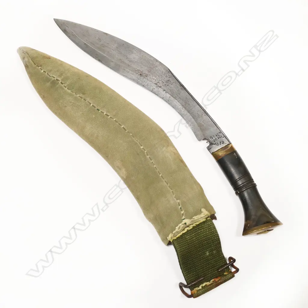 Gurkha Kukri in military scabbard. The Kukri Nepalese made. The scabbard has a WWI/II appearance. The kukri may be more recent. L.400mm Image 1++