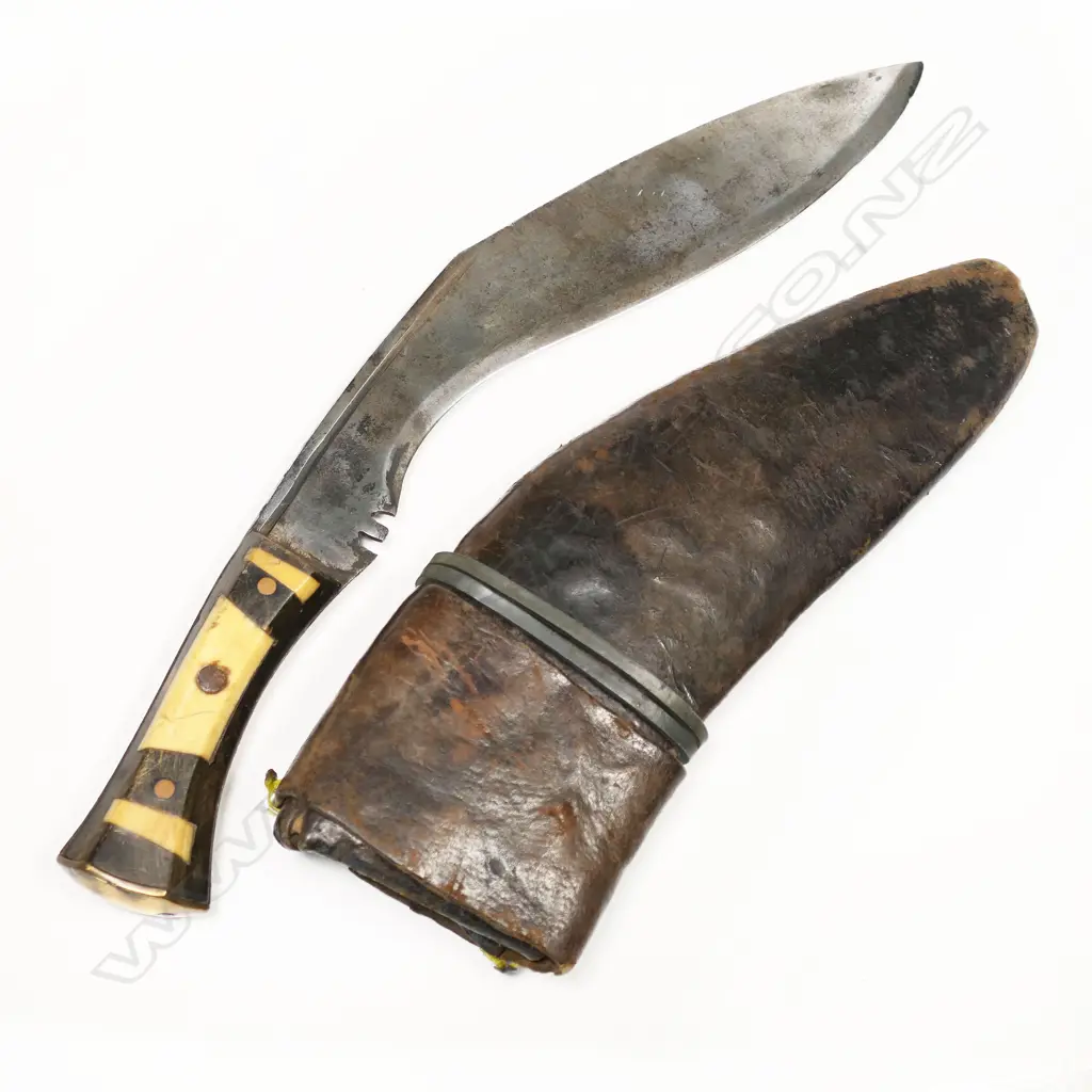Gurkha kukri. An old item in leather scabbard. Bone handle possibly not a military used item but of some age. L.420mm. NOTE: INCORRECT PHOTO ORIGINALLY SHOWN. THIS IS THE CORRECT PHOTO Image 1++