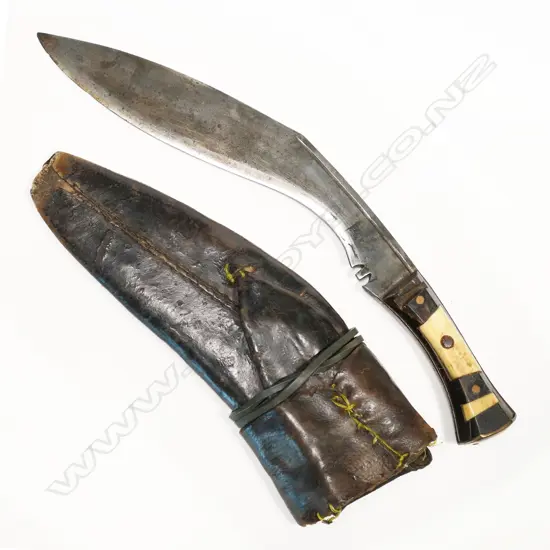 Gurkha kukri. An old item in leather scabbard. Bone handle possibly not a military used item but of some age. L.420mm. NOTE: INCORRECT PHOTO ORIGINALLY SHOWN. THIS IS THE CORRECT PHOTO
