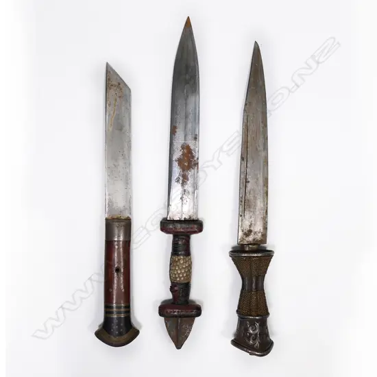Three ethnic knives with scabbards. Lgst 300mm
