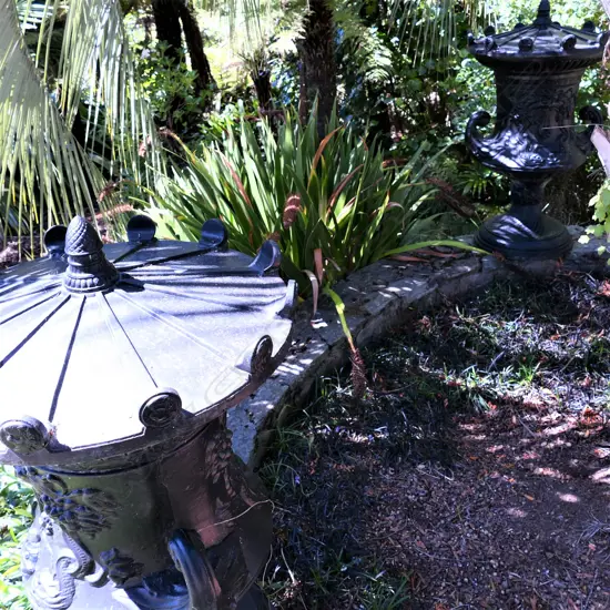 A pair of cast iron large classical urns H.1200mm