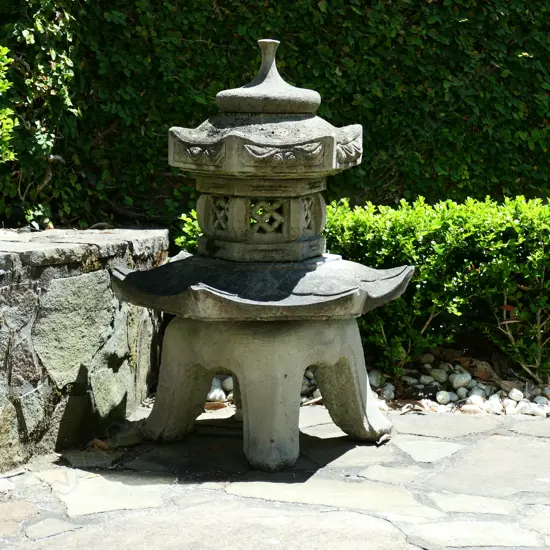 A pair of concrete Chinese temple form outdoor sculptures