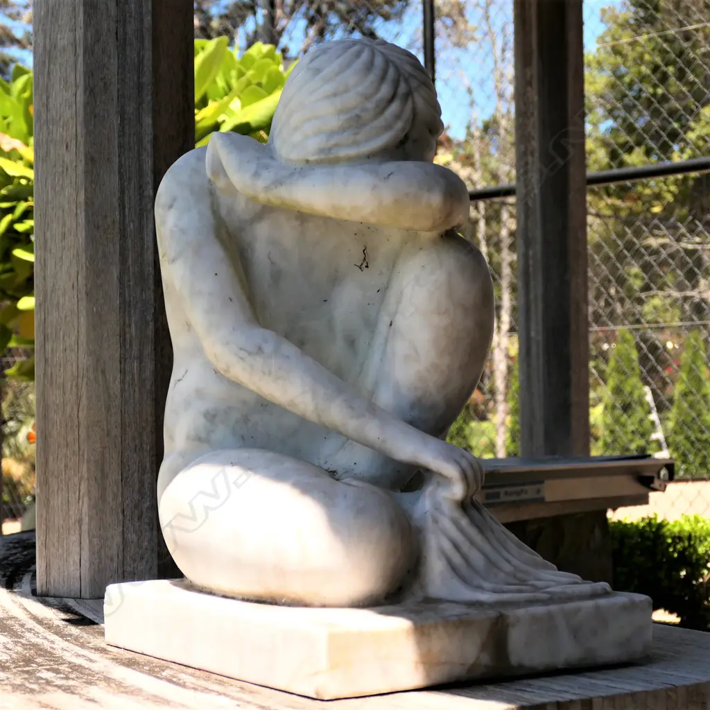 A carved marble naked crouching maiden sculpture Image 1++