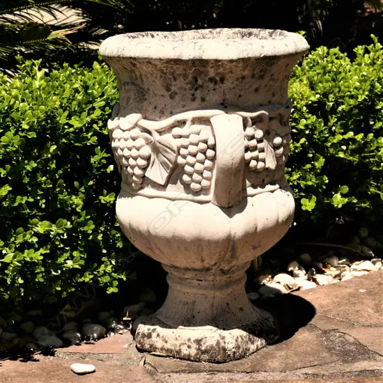 A concrete garden urn - relief grape detail