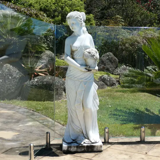 A tall carved marble goddess statue