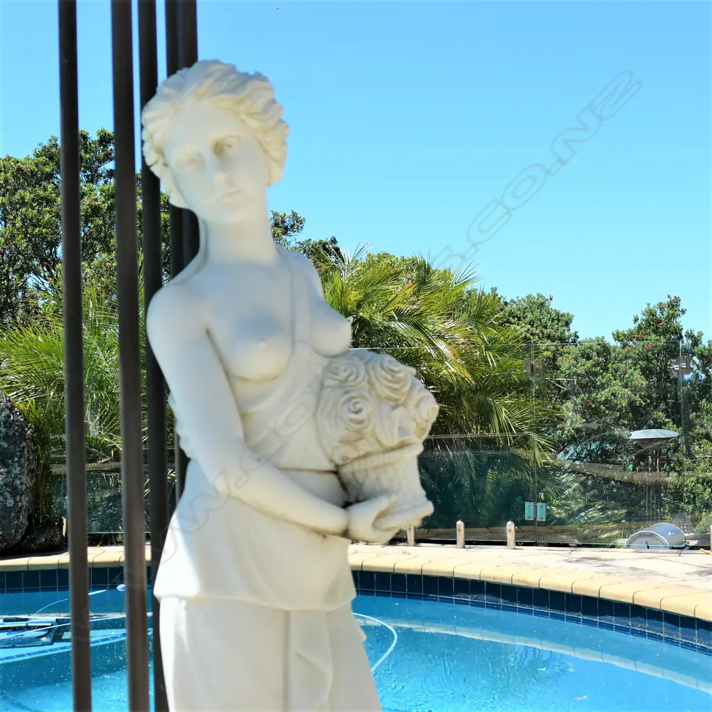 A tall carved marble woman statue Image 1++