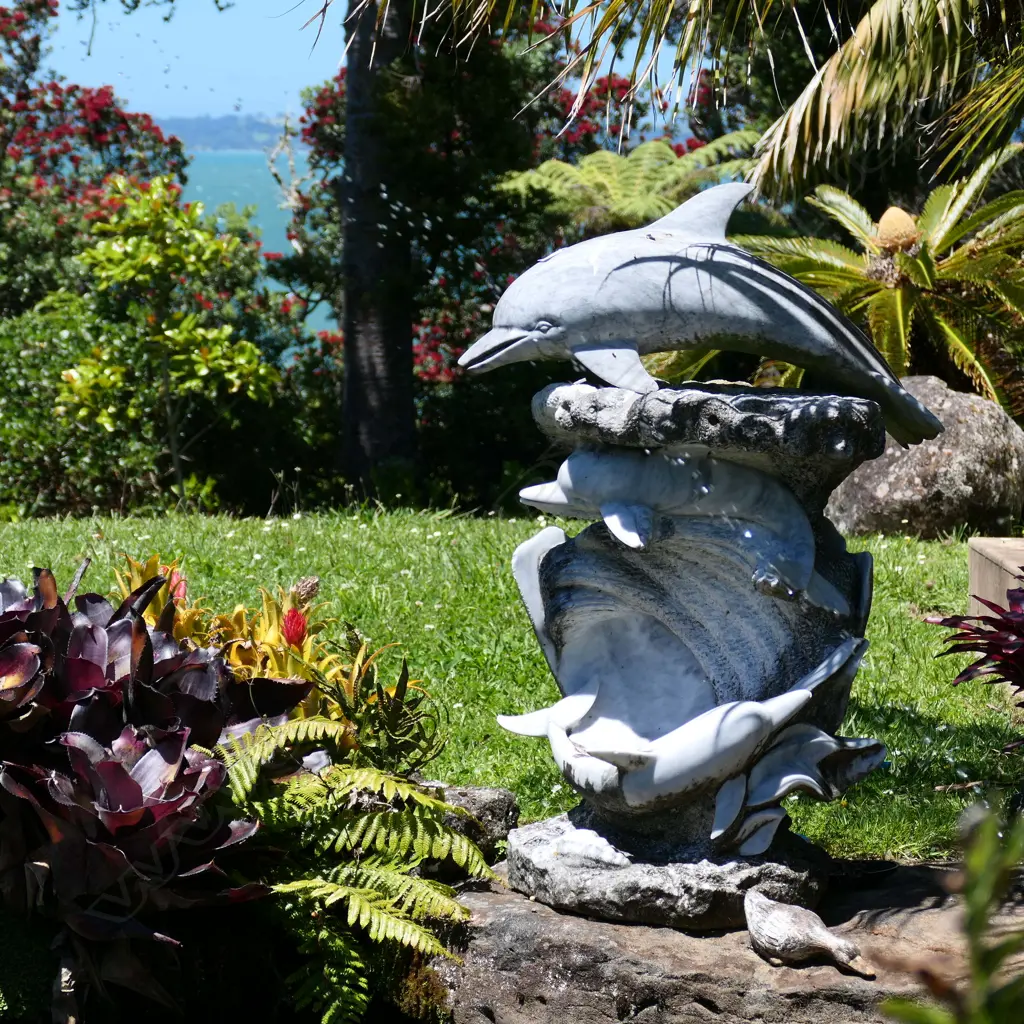 A carved marble dolphin figure group with waves and scallops Image 1++