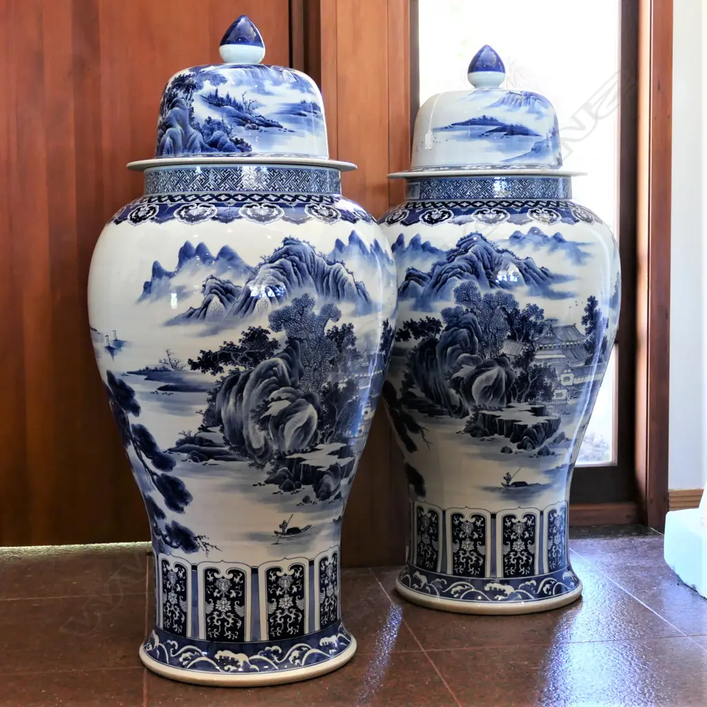 A pair tall Chinese blue and white lidded urns Image 1++