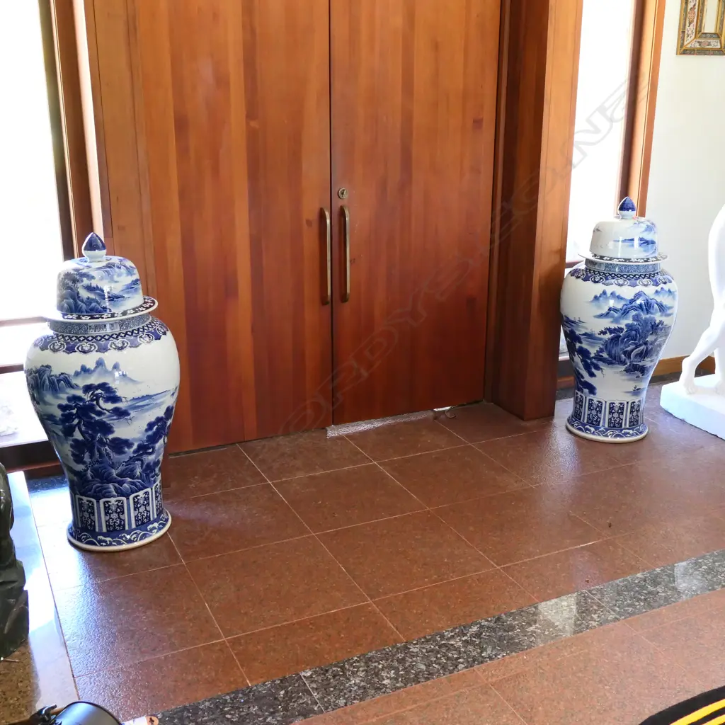 A pair tall Chinese blue and white lidded urns Image 1++