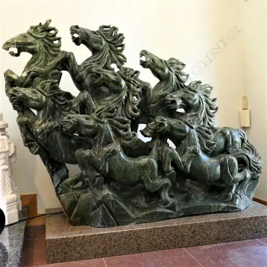 A carved green marble Chinese sculpture