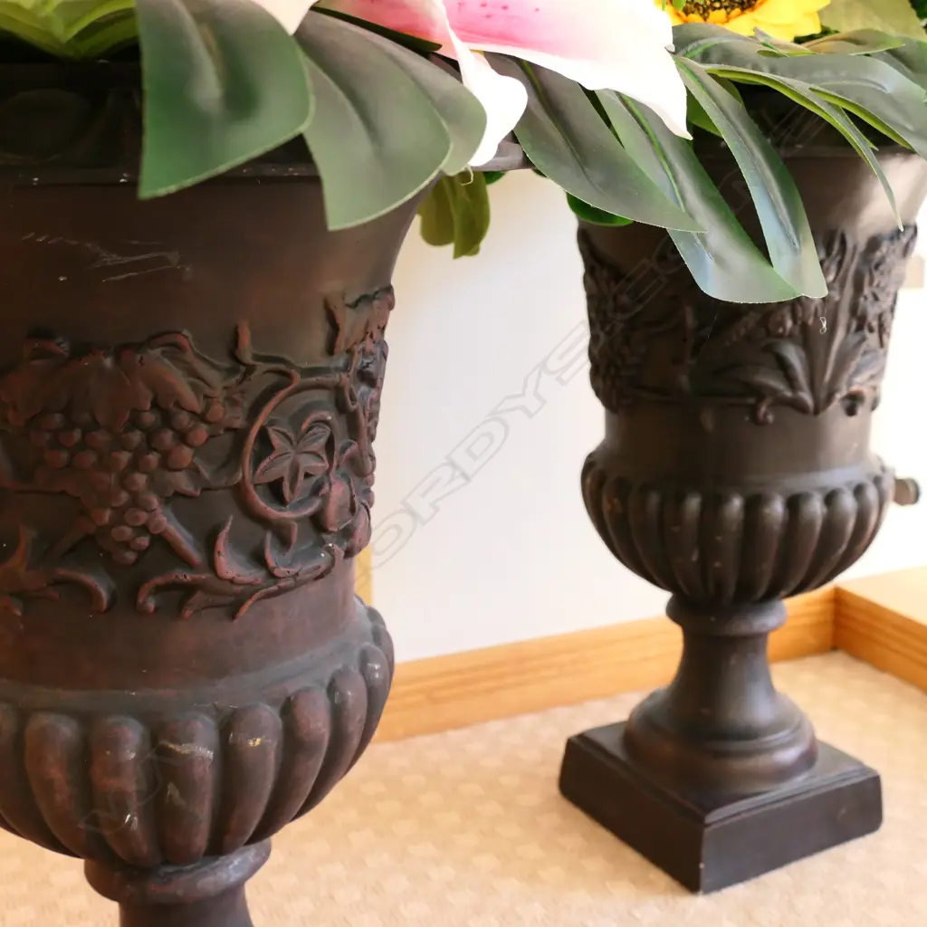 A pair of plastic black classical garden urns Image 1++