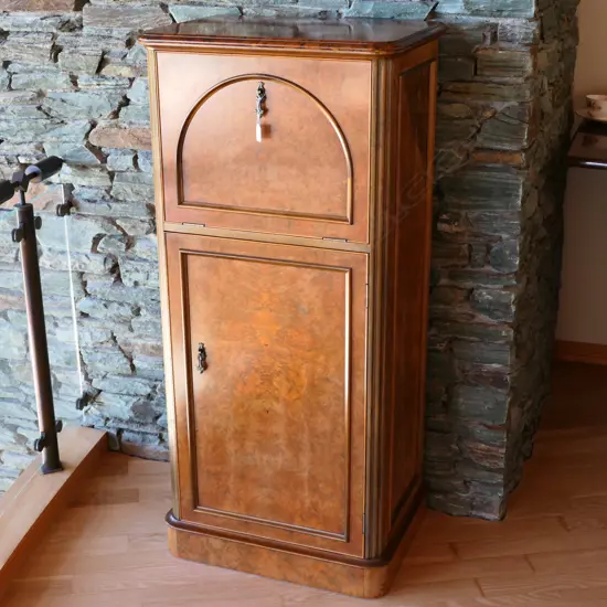 A contemporary antique style burr walnut cocktail cabinet