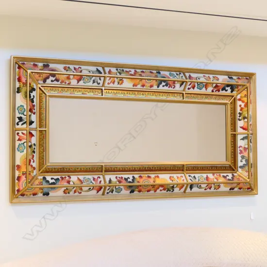 An antique style cushion mirror