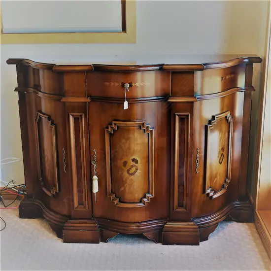 An antique Italian style inlaid sideboard