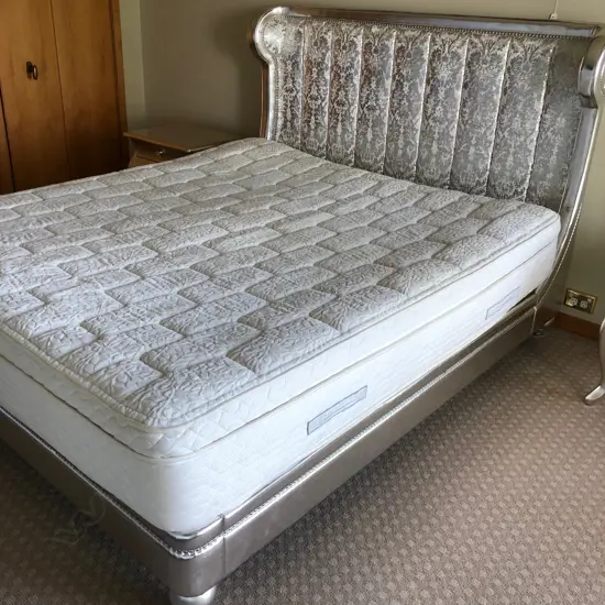 A super king size bed on fixed base and headboard