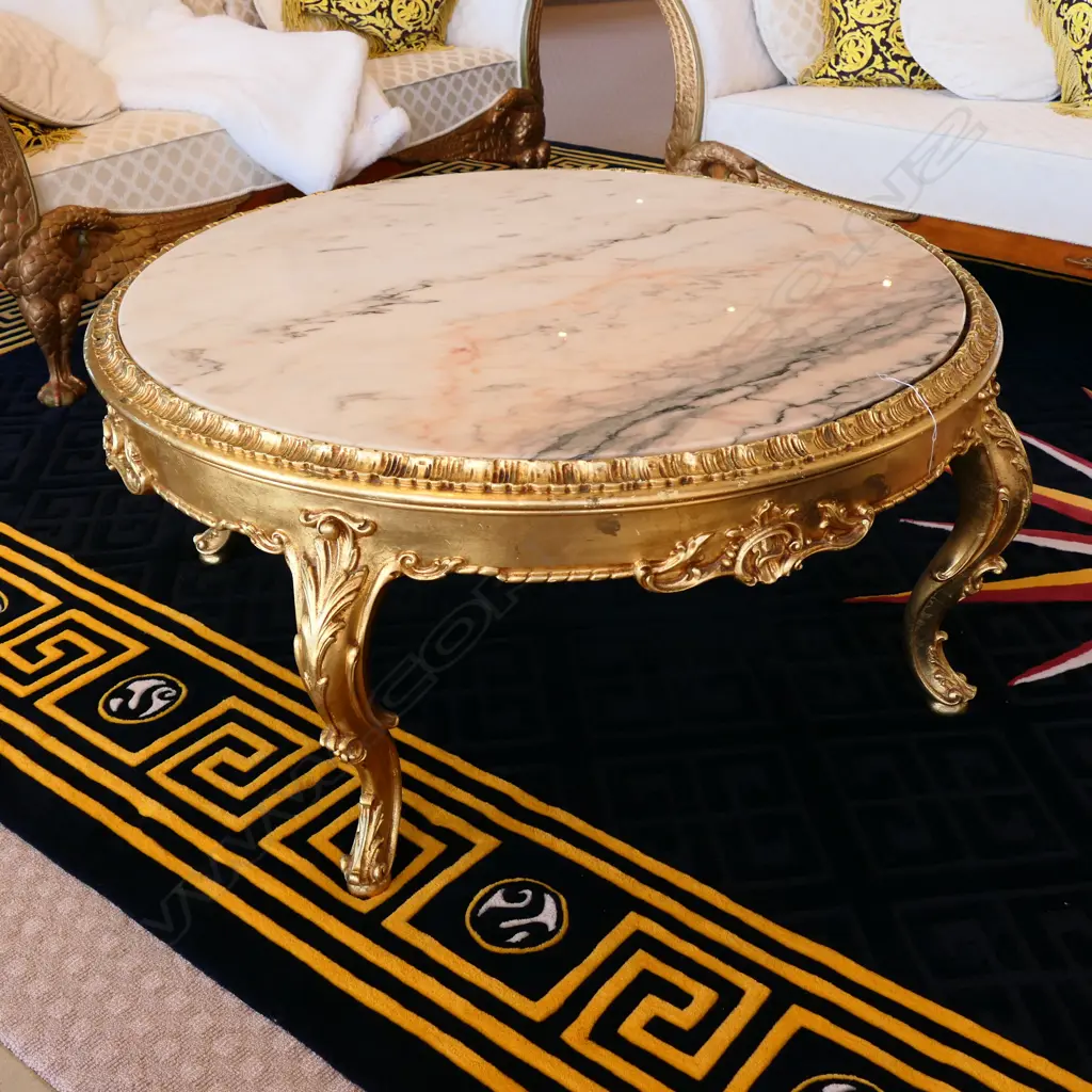 A large circular marble and gilt coffee table Image 1++