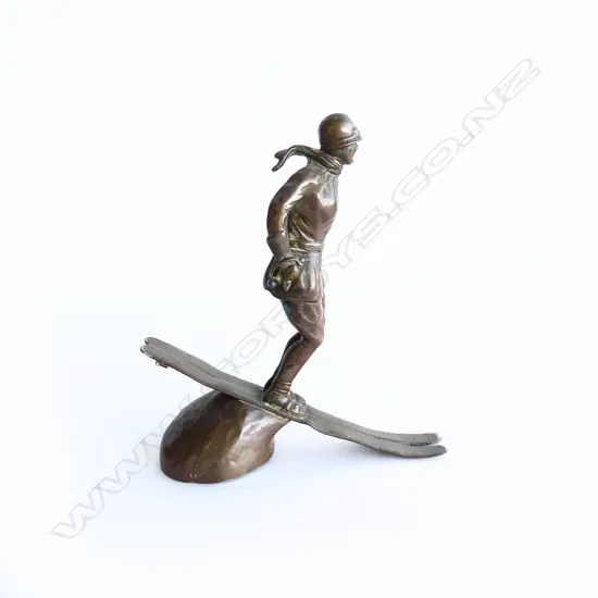 Riley copper/bronze Art Deco female skier (no poles) car mascot,