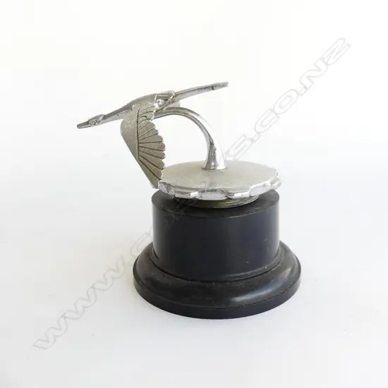 Chrome bird car mascot,