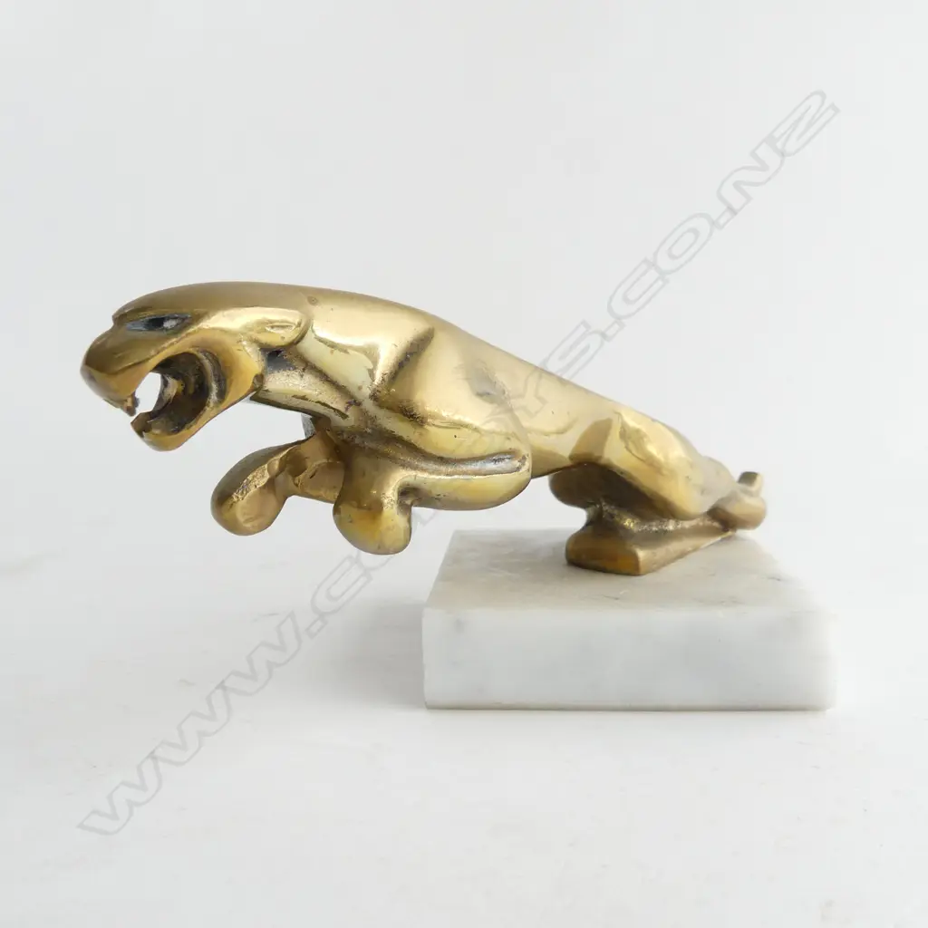 Brass jaguar car mascot on marble, Image 1++