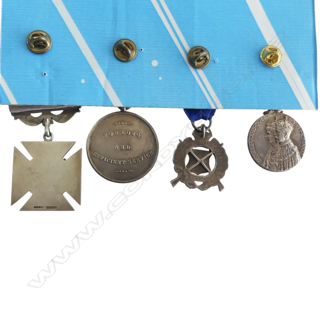 Two NZ silver shooting medals along with Jubilee and Long Service Medals to a bank worker who faced attempted murder and was wounded as the victim of a botched highway robbery attempt; before serving and surviving the Western Front, Image 1++