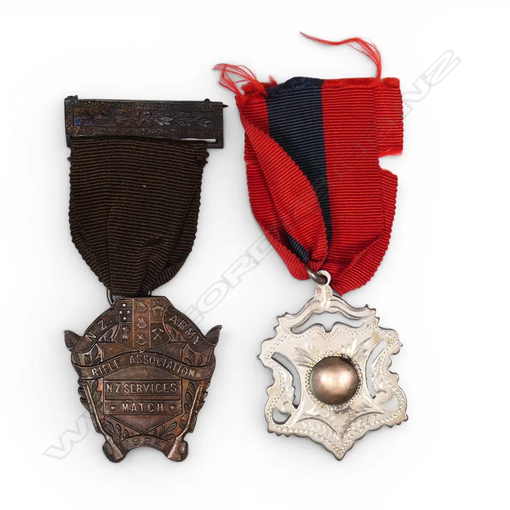Two early 20th century shooting medals with a medal case marked W.R. Bock Engraver Wellington, Image 1++