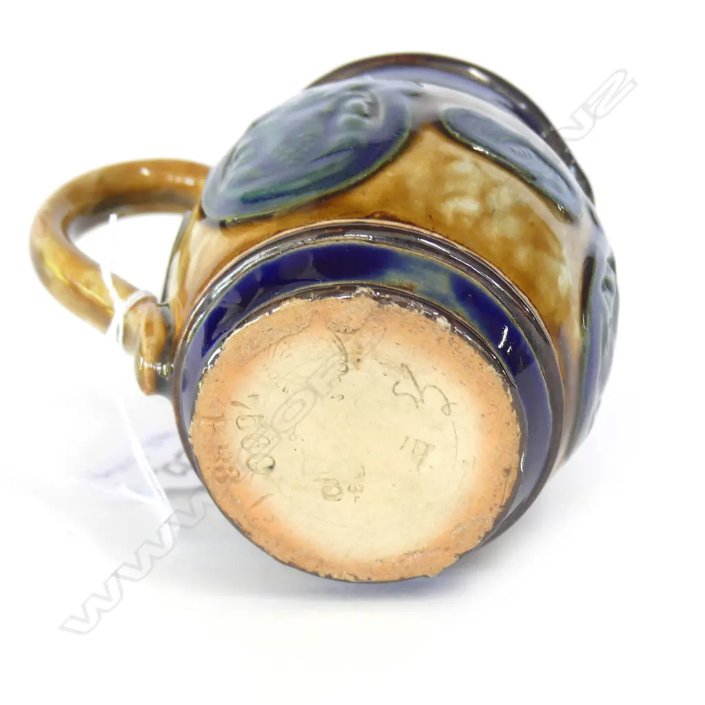 SMALL DOULTON MAORI ART JUG WITH 3 TIKI PANELS H.80mm (hairline cracks to rim, chip to base)) Image 1++