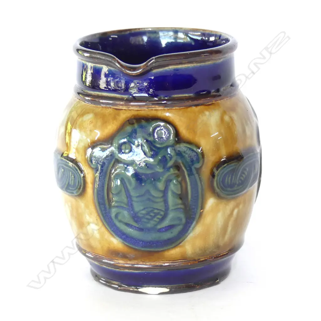SMALL DOULTON MAORI ART JUG WITH 3 TIKI PANELS H.80mm (hairline cracks to rim, chip to base)) Image 1++