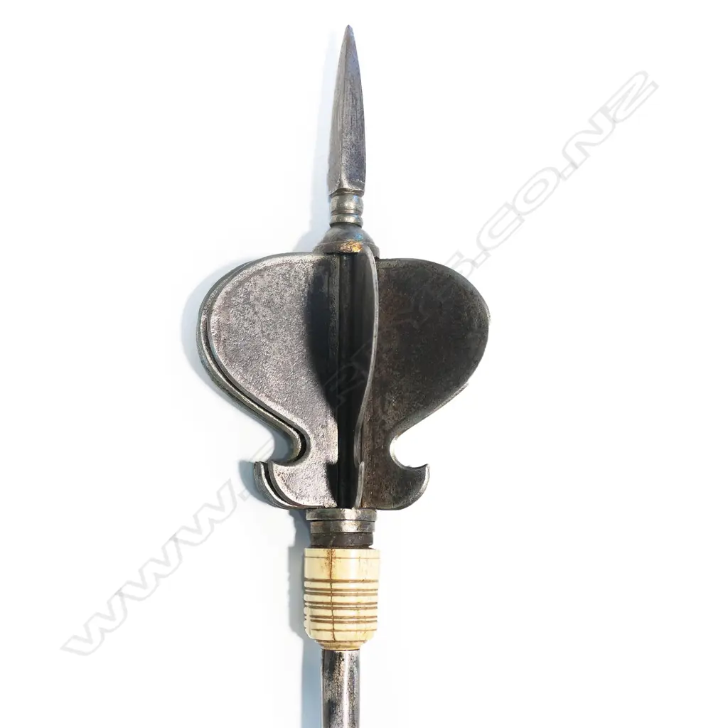 An Indian steel mace with eight ogee shaped flanged head above a bone collar, Image 1++