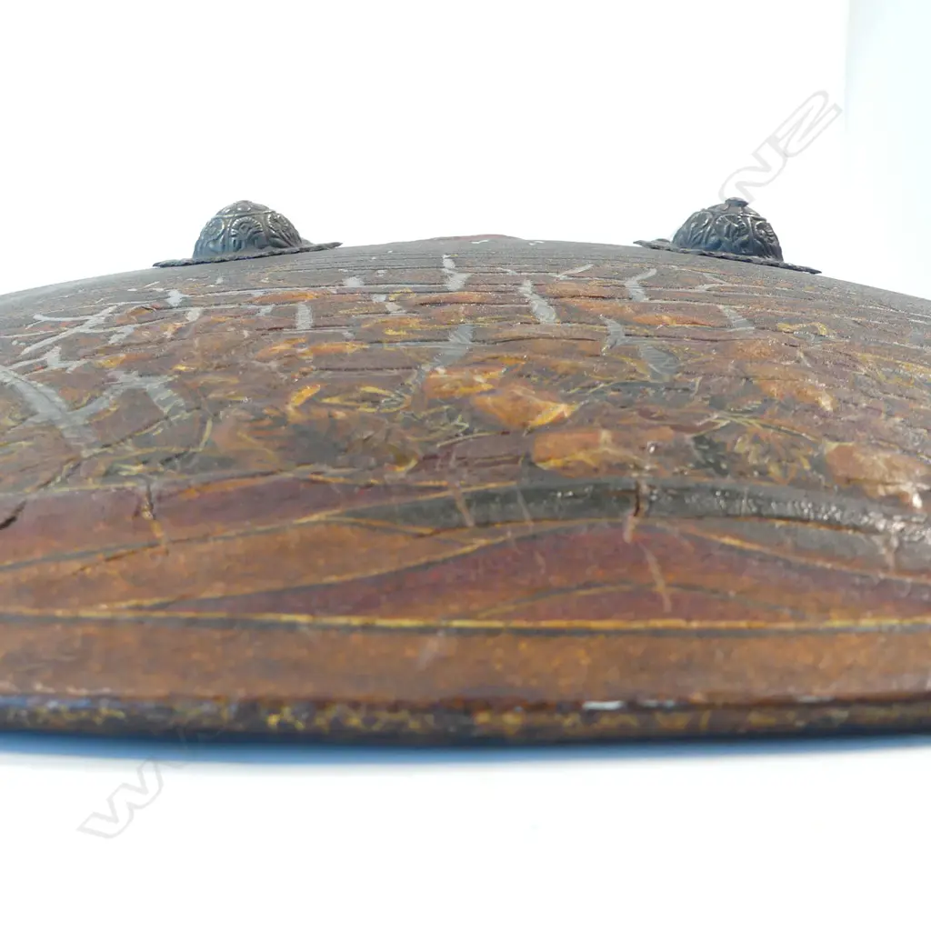 A pair of rare Indian papier mâché dhàl (shields) each with four central silver bosses, with label of provenance to the Governor of Bombay (see footnote 1) and 1998 Christies auction tag (see footnote 2), Image 1++