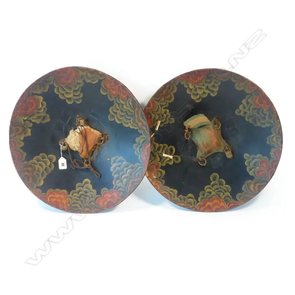 A pair of rare Indian papier mâché dhàl (shields) each with four central silver bosses, with label of provenance to the Governor of Bombay (see footnote 1) and 1998 Christies auction tag (see footnote 2), Image 1++
