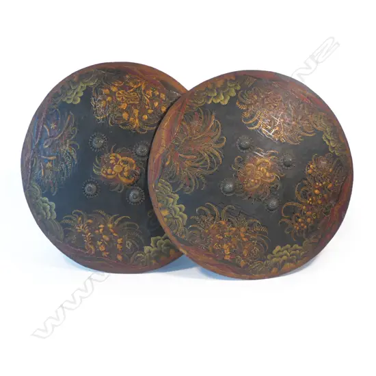 A pair of rare Indian papier mâché dhàl (shields) each with four central silver bosses, with label of provenance to the Governor of Bombay (see footnote 1) and 1998 Christies auction tag (see footnote 2),