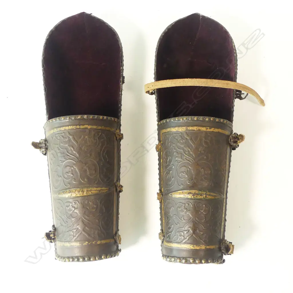 A pair of 18th/19thC Persian bazu-band (forearm armour), iron, with hinged cuff plates, heavily chiseled with foliate tendrils with traces of gilt remaining, Image 1++