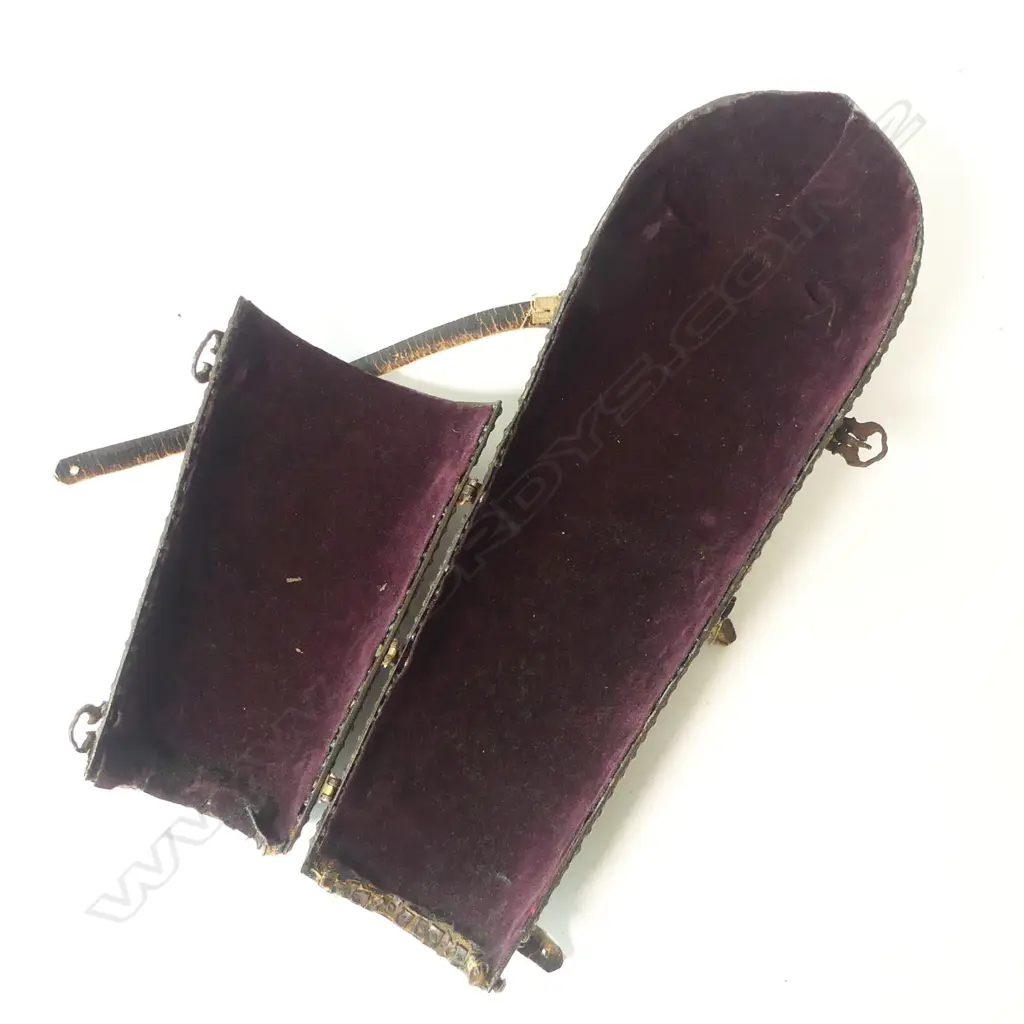 A pair of 18th/19thC Persian bazu-band (forearm armour), iron, with hinged cuff plates, heavily chiseled with foliate tendrils with traces of gilt remaining, Image 1++
