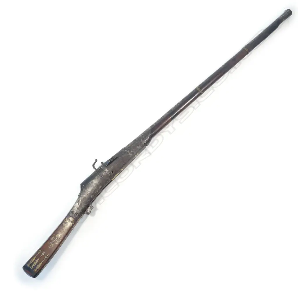 A 6 bore Indian matchlock gun, 19thC., with heavy sighted barrel encrusted with silver scrolls, flowers, foliage and chevrons (losses), retained by a pair of engraved brass bands, Image 1++