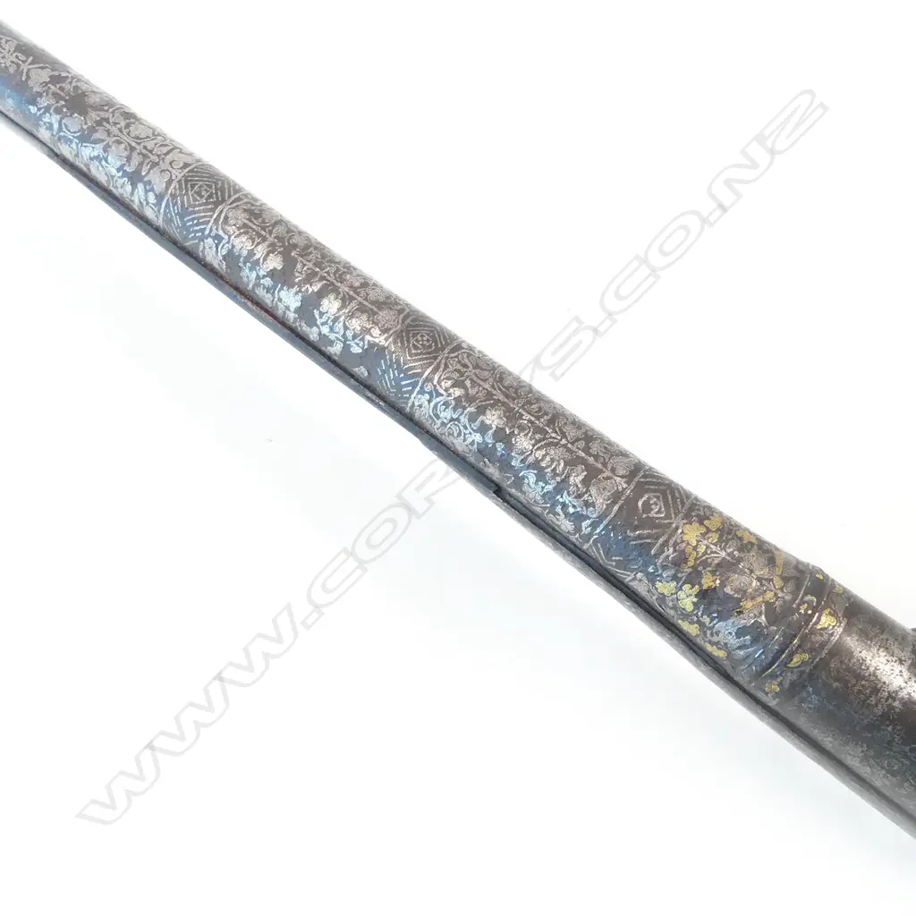 A 6 bore Indian matchlock gun, 19thC., with heavy sighted barrel encrusted with silver scrolls, flowers, foliage and chevrons (losses), retained by a pair of engraved brass bands, Image 1++
