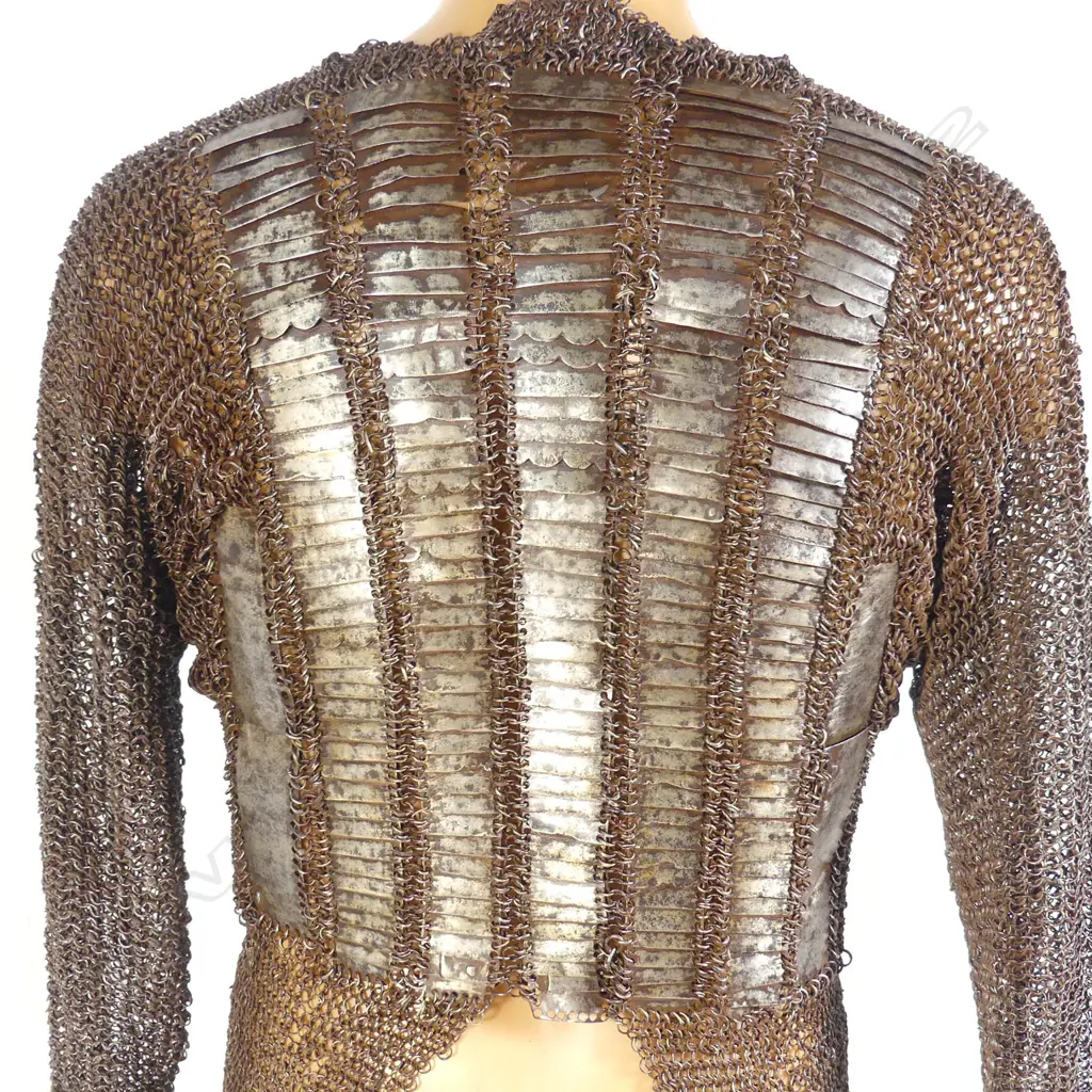 A 17thC Indian mail shirt and head covering with plume. Image 1++